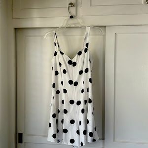 Vintage one piece dark navy blue polka dotted short outfit. The brand is Alice.